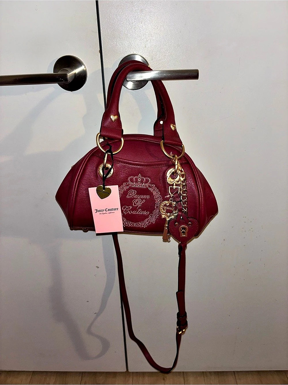 Juicy couture queen of couture Satchel NWT color is cranberry juice